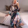 a woman taking a selfie, abaya clothing online