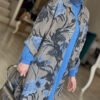 a woman wearing a blue scarf and a floral coat, abaya clothing online
