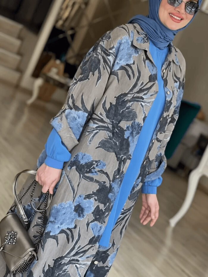 a woman wearing a blue scarf and a floral coat, abaya clothing online
