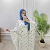 a woman wearing a white dress and blue scarf taking a selfie clothes abaya uk