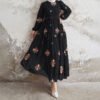 a woman in a black dress abaya style for girl