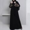 a woman in a black dress Embroidered abaya