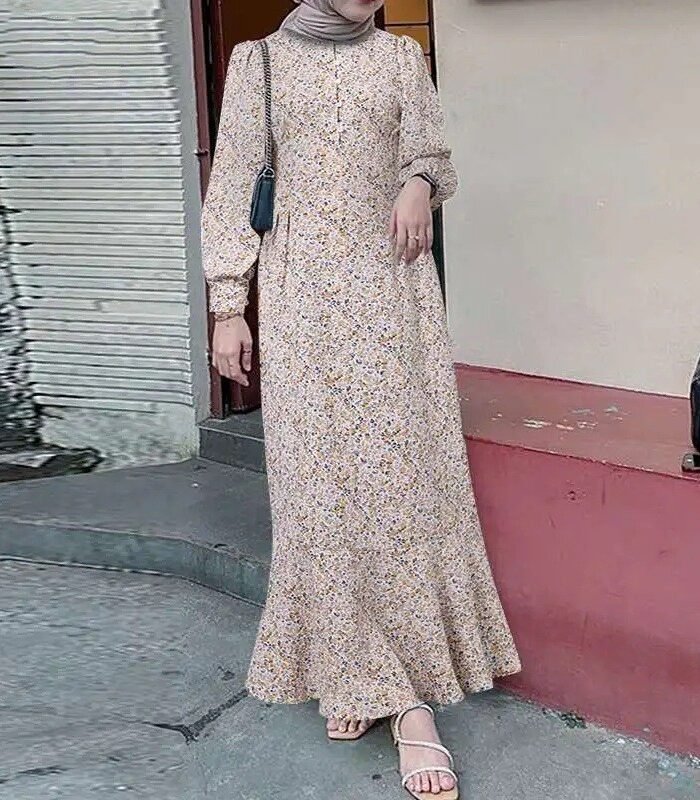 a woman wearing a dress and a scarf, Abaya Fashion in USA