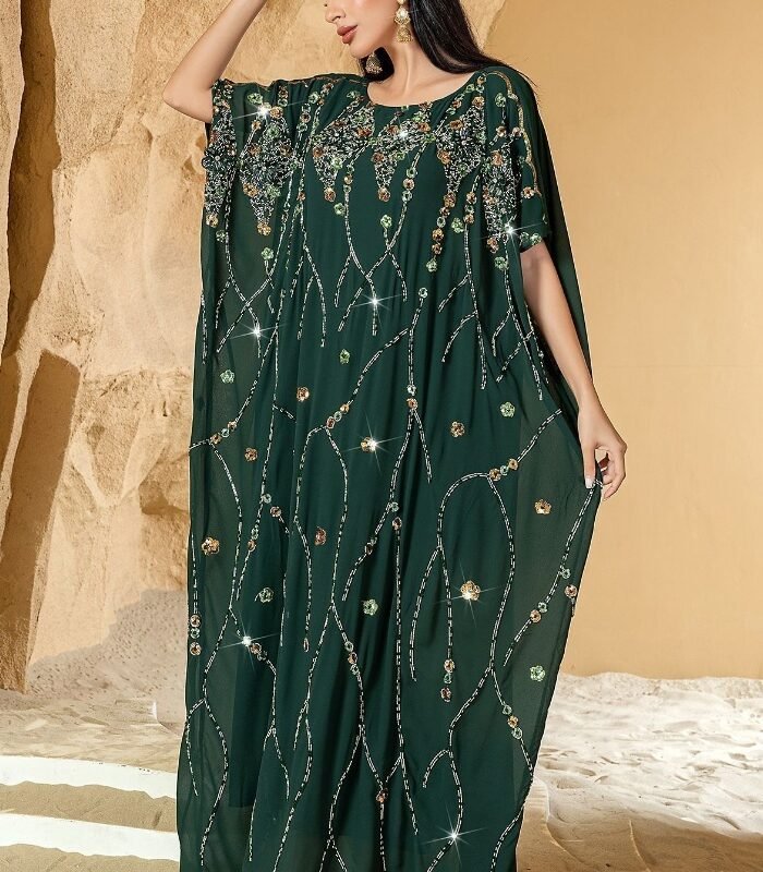 a woman in a green dress ceremony dress
