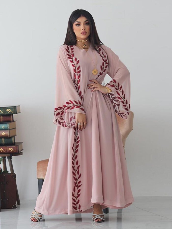 a woman in a pink dress, fashion abayas