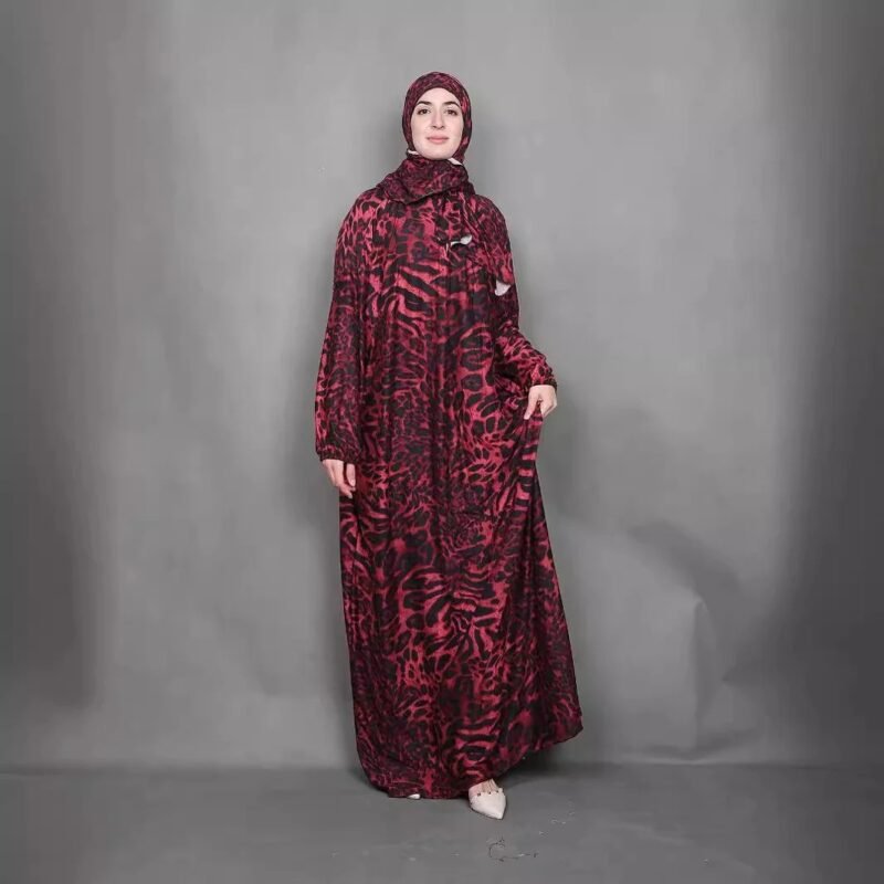 a woman in a red and black dress, somali hijab fashion