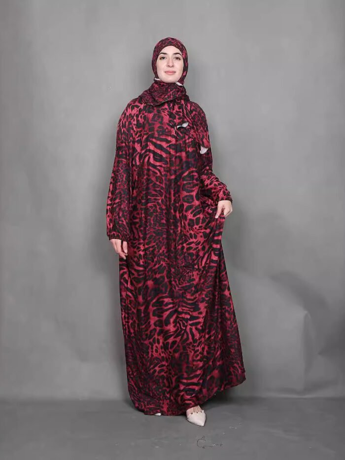 a woman in a red and black dress, somali dress