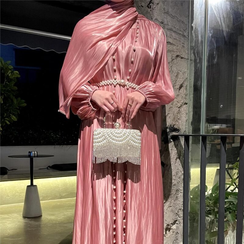 a woman in a pink dress,
abaya dresses