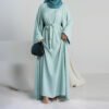 a woman in a blue dress, abaya for sale