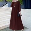a woman in a long dress, abaya fashion model