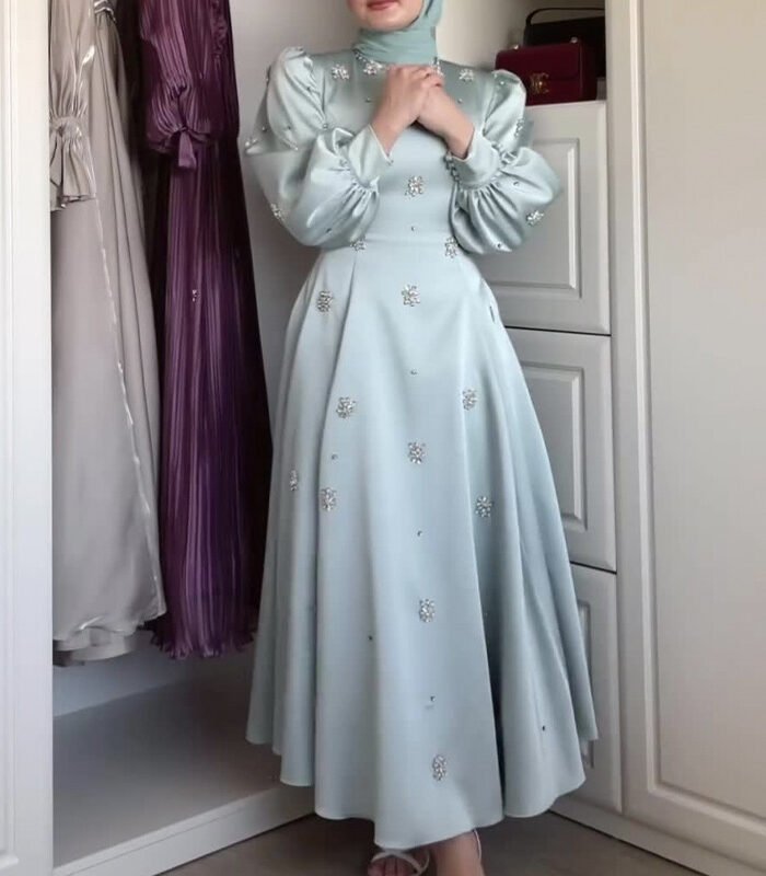 a woman in a dress, muslimah dresses