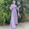 a woman in a long dress, abaya style new