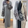 a woman taking a selfie, abaya emirati
