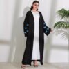 Unstoppable Abaya Butterfly – A Majestic Fusion of Grace & Power 12 a woman in a long black robe, butterfly abayas, Plus Size Butterfly Abaya ,abaya butterfly