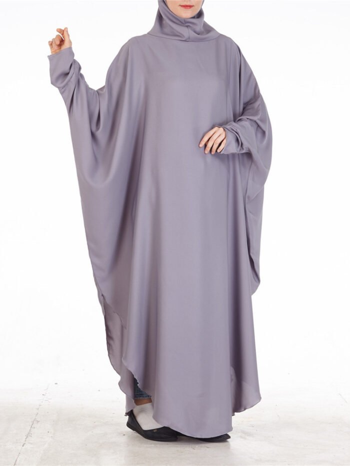 a woman in a long dress, muslim woman's garment