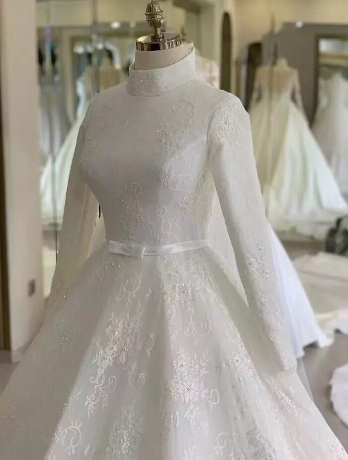 a white dress on a mannequin, wedding gown for muslim