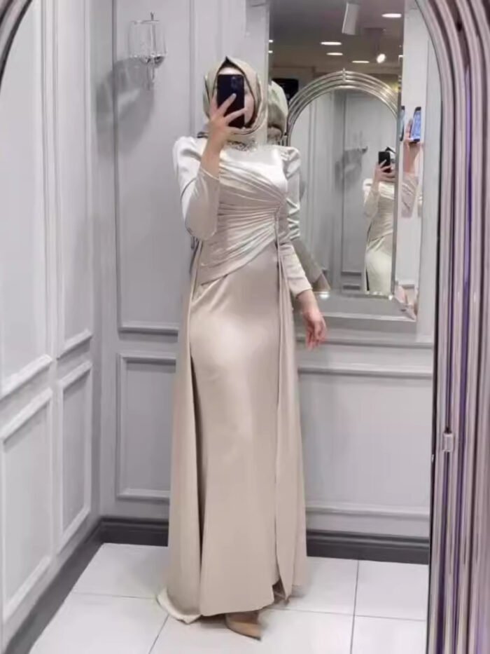 a woman taking a selfie in a mirror,ladies islamic wear