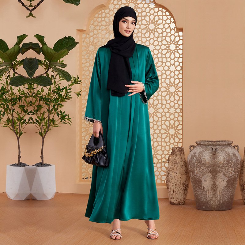 How Much is an Abaya Dress? A Comprehensive Guide 6 a woman in a green dress,dresses for hijabis