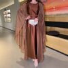 a woman in a brown dress, formal modest dresses