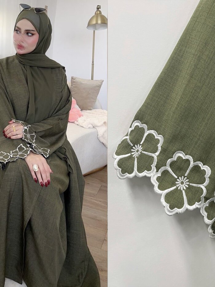 a woman sitting on a couch, islamic clothing for women