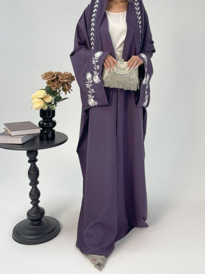 a woman in a purple robe,muslim clothing for females