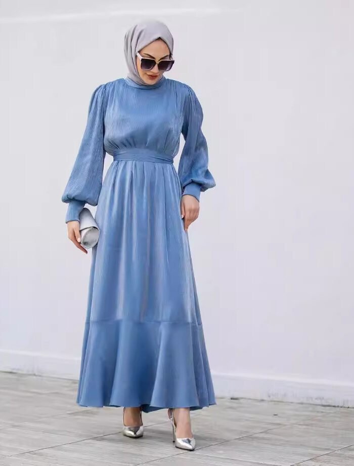 a woman in a blue dress, dress for nikah