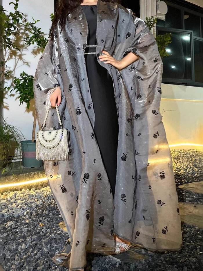 a woman in a long dress, muslim wear women