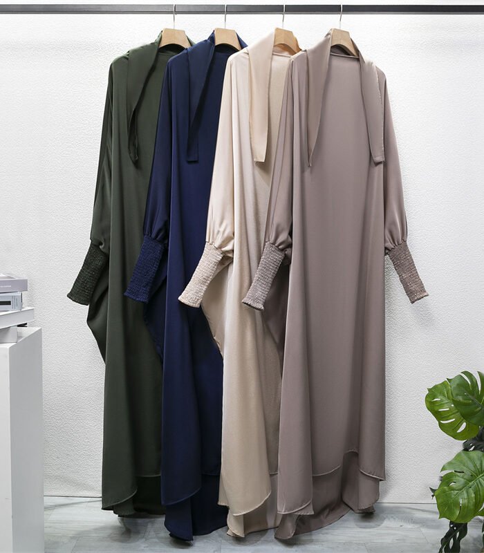 a group of long dresses on swingers,Cotton Abaya, Best Abaya Fabrics for Summer