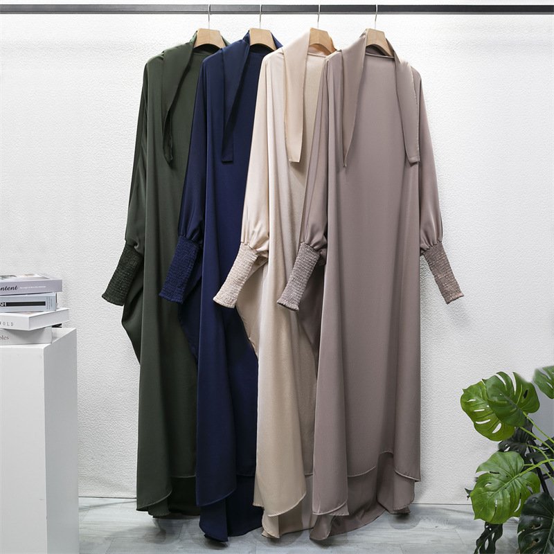 Top 7 Best Abaya Fabrics for Summer – Stay Cool, Comfortable, and Elegant in Hot Weather 2 a group of long dresses on swingers,Cotton Abaya,
Best Abaya Fabrics for Summer
