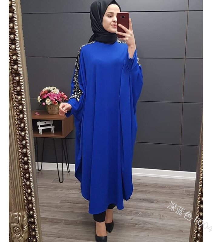 a woman in a blue dress taking a selfie, dress for muslims